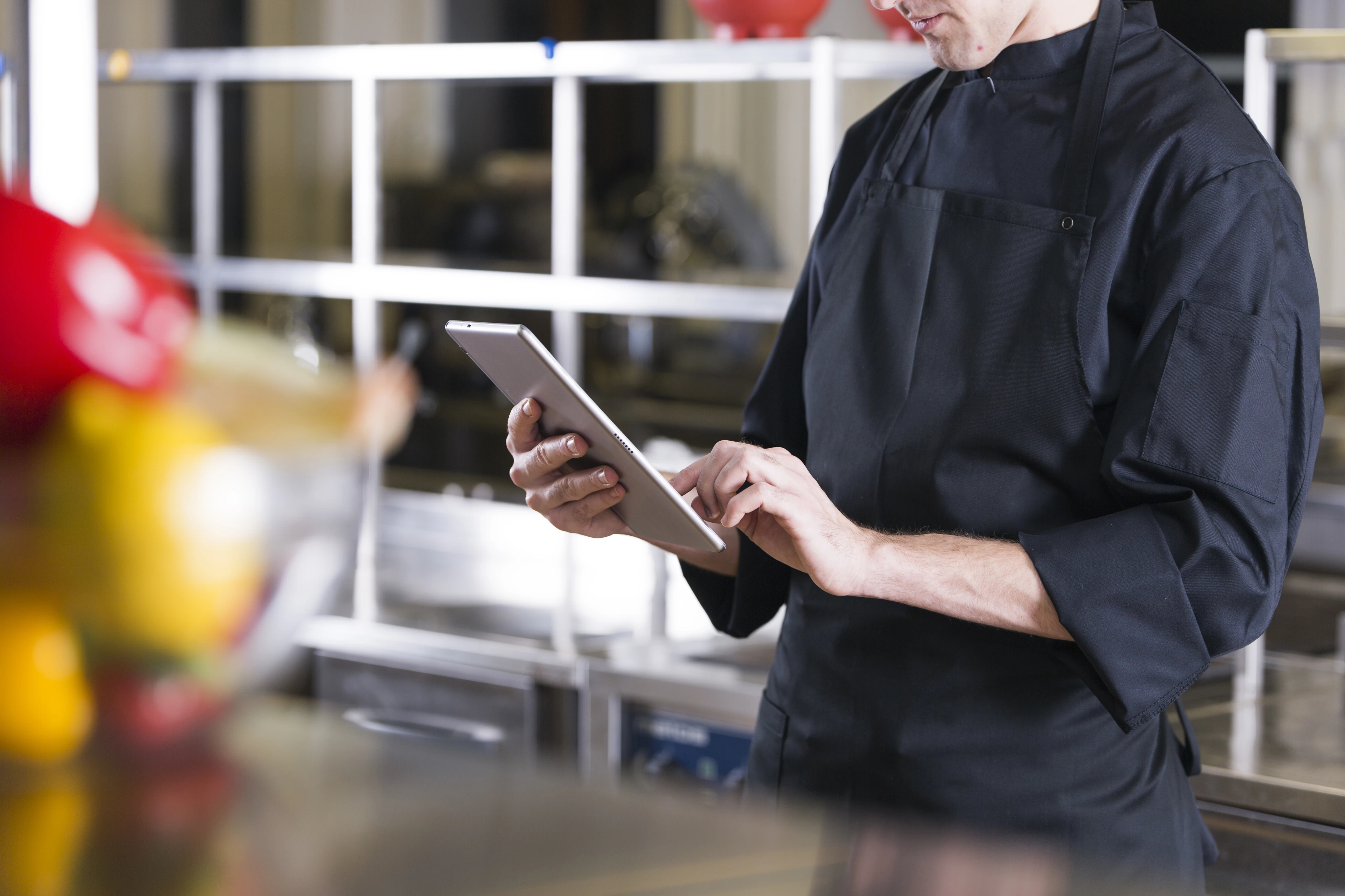 A close up of a digital tablet POS being interacted with